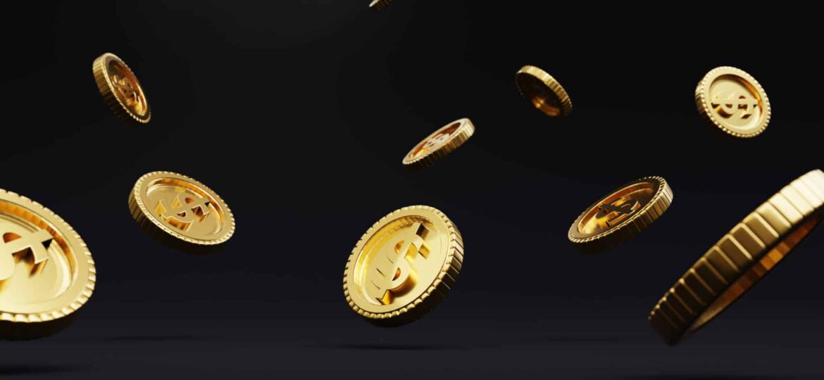 Closeup of golden USD coins dropping on dark background , Dollar